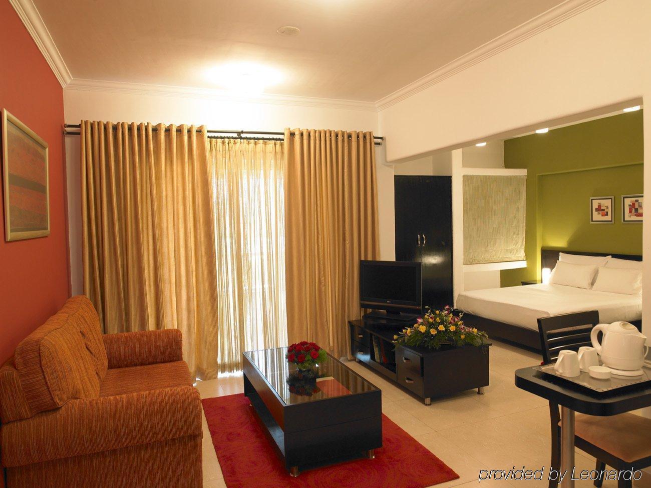 Royal Orchid Golden Suites Púna Szoba fotó
